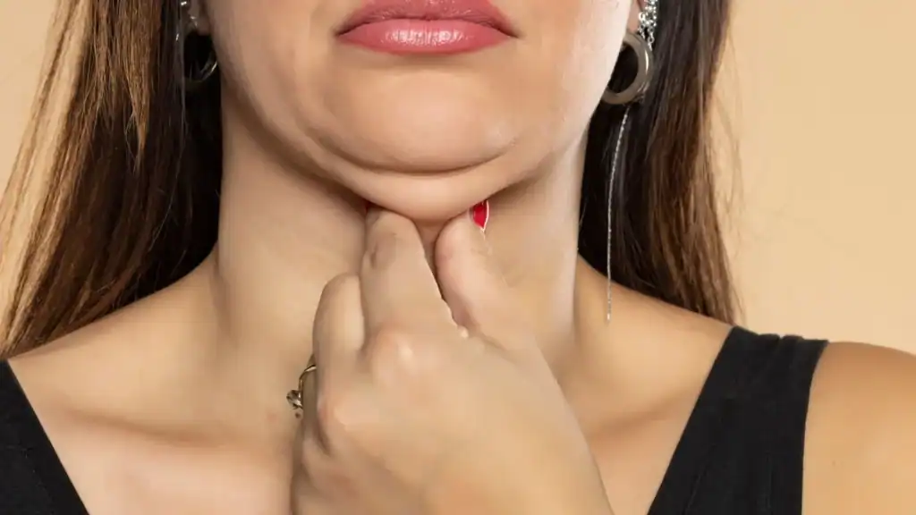 An image of a woman with double chin, sad, worried : Non Surgical Double Chin Removal Treatment in Gorgie, UK